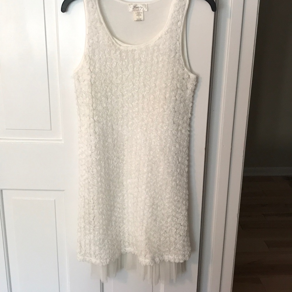 Simple white dress with textured detail